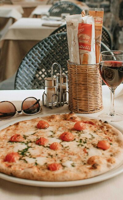 Traditional pizza enjoyed by the lake