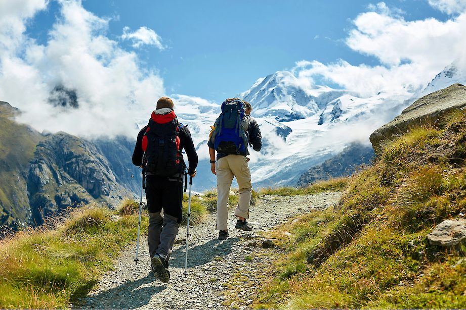 Hiking into snow-capped mountains. Unsplash@Getty Images