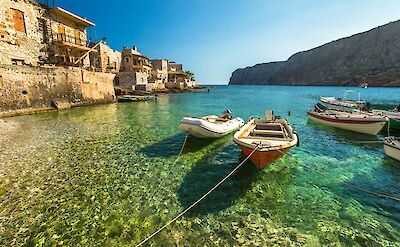 Clear turquoise harbor in Gerolimenas fishing village. toABB