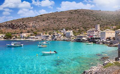 Fishing boats along the waterfront in Limeni. toABB