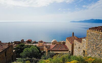 Medieval stone buildings and sea views in Monemvasia old town. pexels@AdrienOlichon