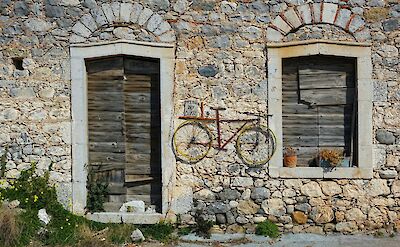 Traditional stone houses in the Mani Peninsula. Unsplash@TimBroadbent