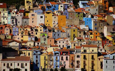 Colorful hillside buildings in the historic center of Bosa. unsplash@JurgenScheeff