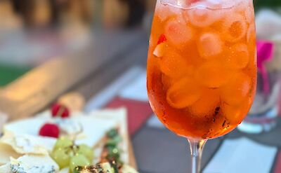 Aperitivo featuring local cheeses, seasonal vegetables, and an Aperol Spritz. pexels@AprilChoitz