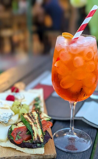 Aperitivo featuring local cheeses, seasonal vegetables, and an Aperol Spritz. pexels@AprilChoitz