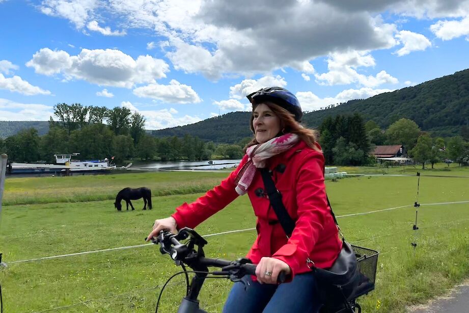 A cyclist riding along a bicycle path in Collenberg, Germany. CC:Rosalind Perrett
