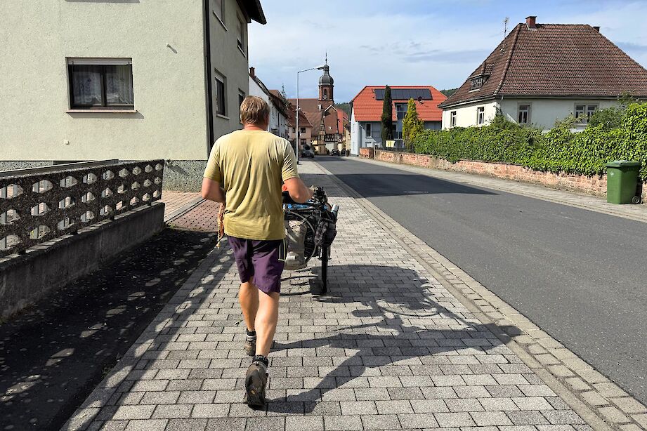 Karl Bushby walking through a town near Obernburg, Germany. CC:Rosalind Perrett