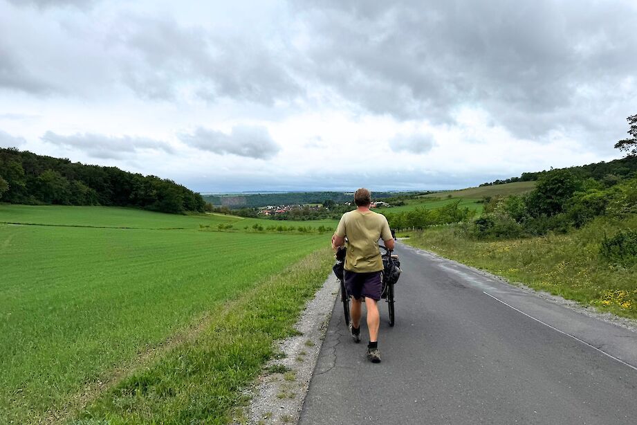 Karl Bushby walking towards a village in Germany. CC:Rosalind Perrett