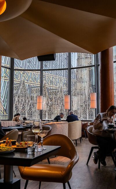 A restaurant overlooking St. Stephen's in Austria Unsplash@Kate K