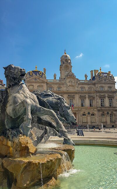 Bartholdi Fountain in Place des Terreaux with Lyon City Hall. unsplash:JonneMakikyro