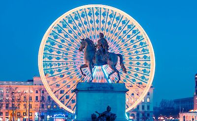 Place Bellecour with the Ferris wheel and statue of Louis XIV. unsplash:GettyImages