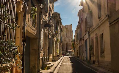 Sunlit street in Arles' historic center. pixabay:teefarm