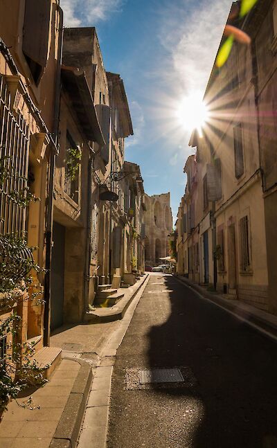 Sunlit street in Arles' historic center. pixabay:teefarm