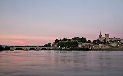 Sunset over the Rh&ocirc;ne River in Avignon. unsplash:JoelVogt