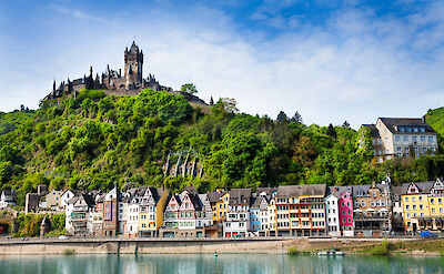 Colorful riverside Cochem crowned by the impressive Reichsburg Castle.. to:TN