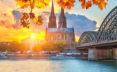 Cologne Cathedral and the Hohenzollern Bridge at sunset. to:TN