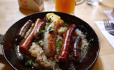 Traditional German bratwurst with sauerkraut. pixabay:tknight67