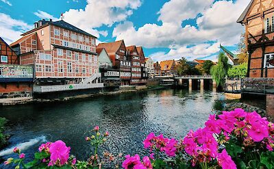 The Ilmenau River flowing through L&uuml;neburg's historic waterfront. Unsplash:SebastianPuskeiler