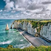 Paris & Normandy: Seine River Bike & Boat - The dramatic white cliffs of Étretat. unsplash:AllysonBeaucourt