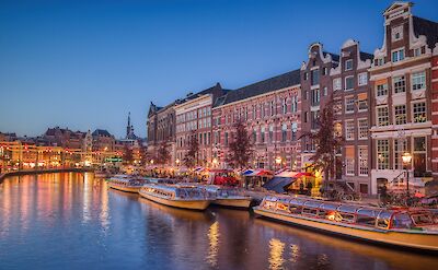 Amsterdam&rsquo;s historic canal houses at dusk. pixabay:IulianUrsache