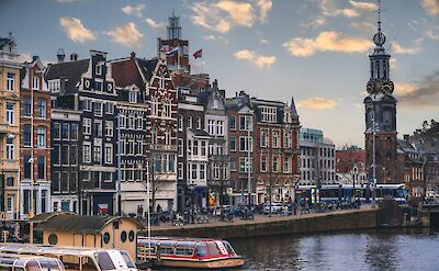 Historic canal houses along Amsterdam&rsquo;s waterfront. unsplash:AnmolKataria