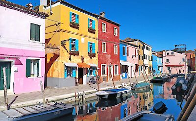Colorful houses along the canals of Burano. ToGL