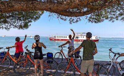 Cyclists preparing to board a ferry. toGL