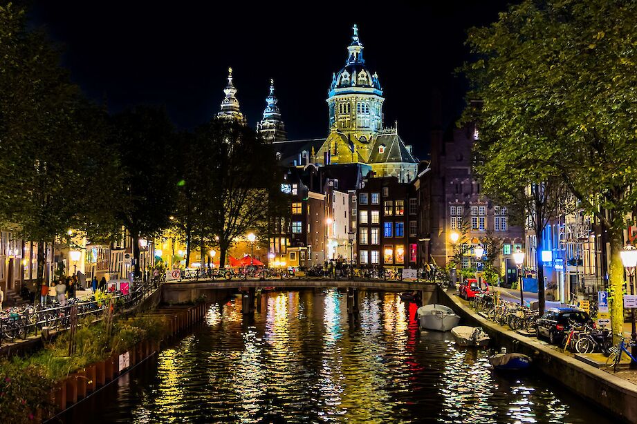 Amsterdam lit up at night, Netherlands. iStock@Gianfranco Vivi