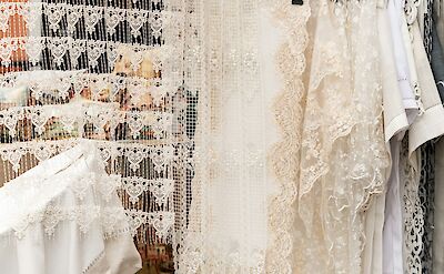 Intricate handmade lace, a centuries-old tradition of Burano. unsplash:LauraAdai