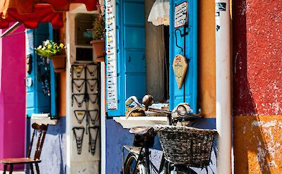 Local shops and colorful buildings in Burano. unsplash:MarcoChilese