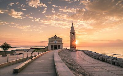 The Church of Madonna dell&rsquo;Angelo in Caorle at sunset, overlooking the Adriatic Sea. Unsplash:KarstenWurth