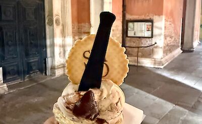 Enjoying gelato while exploring the streets of Venice. cc:Tripsite
