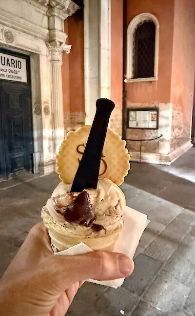 Enjoying gelato while exploring the streets of Venice. cc:Tripsite