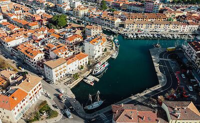 Aerial view of Grado's historic center and waterfront along Italy's Adriatic coast. unsplash:GabrieleDomicolo