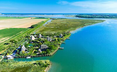 Aerial view of the Adriatic coastline and lagoon waterways. cc:to