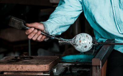 Traditional glassmaking demonstration on Murano. unsplash:salvatoreTonnara