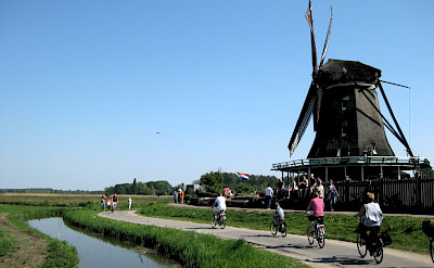 Quiet bike paths past windmills in Zaanse Schans, North Holland. Flickr:iorek7z