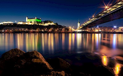 Colorful lights reflected in the water, Bratislava, Slovakia. Unsplash@Lukas Kulla