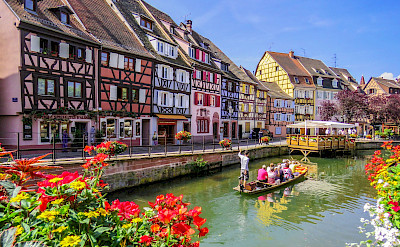 Biking and boat ride along the canal in Colmar, Alsace, France. Photo via Flickr:Kiefer