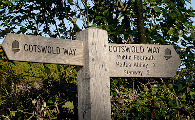 Signs lead the way through the Cotswold Hills. Photo via Flickr:Richard Cocks