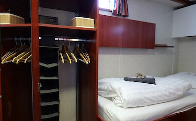 Cabin bed and closet | Clair d&rsquo;Etoile | Bike & Boat Tour