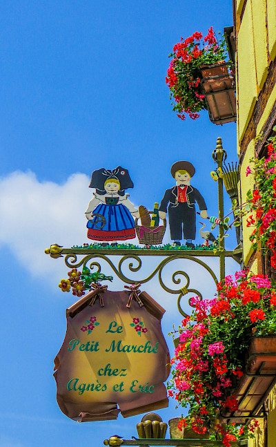 Signs mark the way in Eguisheim, Alsace, France. Flickr:Kiefer