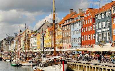 Biking through Nyhavn or "New Harbor" in Copenhagen, Denmark. Flickr:Dimitris Karagiorgos