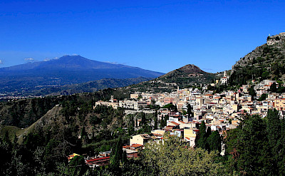 View of Taormina and Mt Etna from ancient theatre in Sicily, Italy. Wikimedia Commons:John Menard