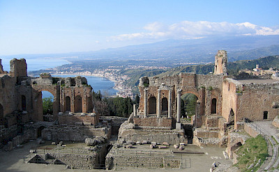 Ruins of the Greek Theatre overlooking the Sea in Taormina, Sicily, Italy. Wikimedia Commons:Evan Erickson CC0