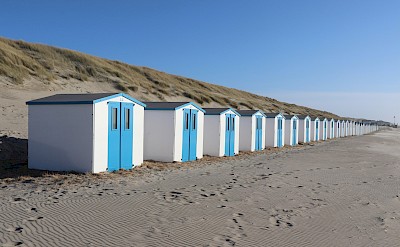Beach huts, Island of Texel, Netherlands. Unsplash@Julia Taubitz