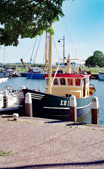 Boats in the harbor, Enkhuizen, Netherlands. Unsplash@Chris Weiher
