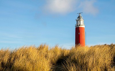 Clouds above the lighthouse, Island of Texel, Netherlands. Unsplash@Marieke Koenders