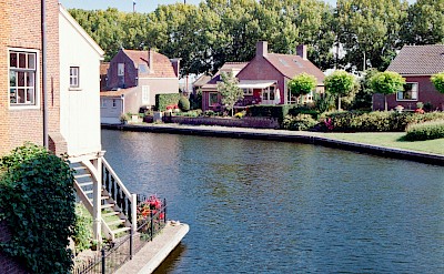 Houses along a canal, Enkhuizen, Netherlands. Unsplash@Chris Weiher