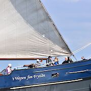 Guests on the front deck of the Wapen Fan Fryslân | Bike & Boat Tour